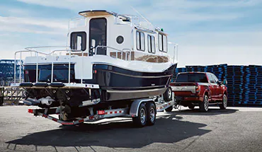 2022 Nissan TITAN Truck towing boat | Marshall Nissan in Salina KS